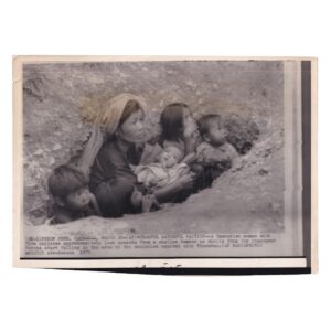 Home 6 Associated Press Wire Photograph - Cambodian Family Sheltering During Bombardment of Phnom Penh - March 1975