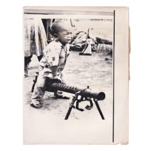 Cambodian Civil War - Child Astride His Father’s Machine Gun at Toul Leap - Original Associated Press Photograph - 1973