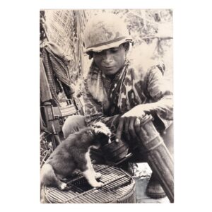Battlefield Pup - Cambodian Soldier Feeding His Puppy from a Shell Case near Phnom Penh - Original Associated Press Photograph - 1975