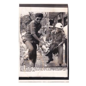 Home 4 Rocket Attack Victim Carried to Safety in Phnom Penh - Original Associated Press Wirephoto - 4 March 1975